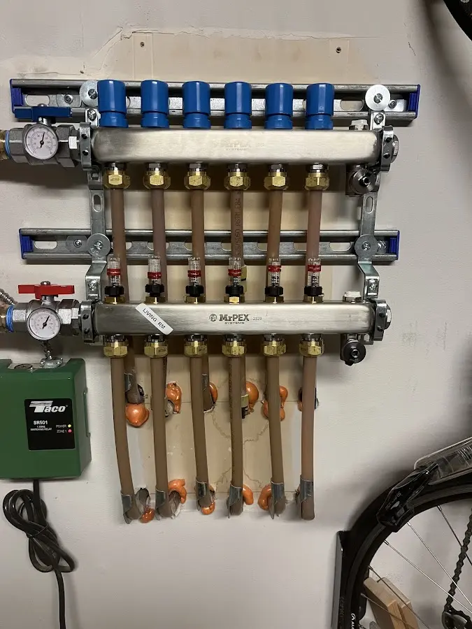 Plumber performing Water Heater Repair at a residential property in O'Neill